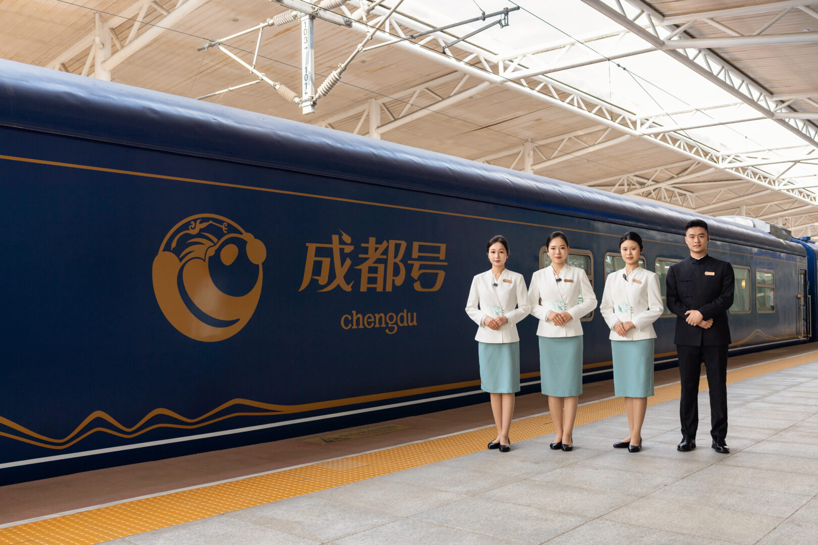 Huayun train and service team at a station platform